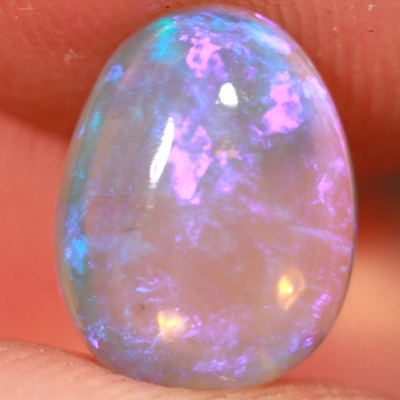 SOLID CRYSTAL OPAL Transparent with purple moving within